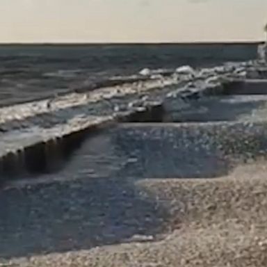 Ease into a new week with the soothing sights and sounds of waves carrying ice pancakes lapping against a lake pier in Saint Joseph, Michigan.