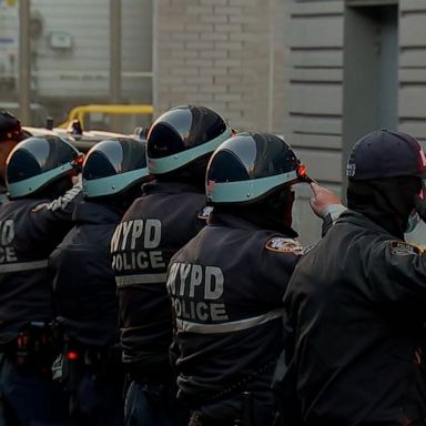 The officers died after being shot at a domestic violence call in Harlem.