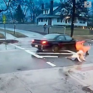 A Maryland police officer narrowly pushed a student out of the path of a moving car that failed to stop at the crosswalk.