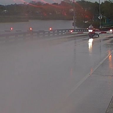 Surveillance video captured a motorcyclist who drove through a closed gate and up a raised drawbridge in Daytona Beach, Florida.