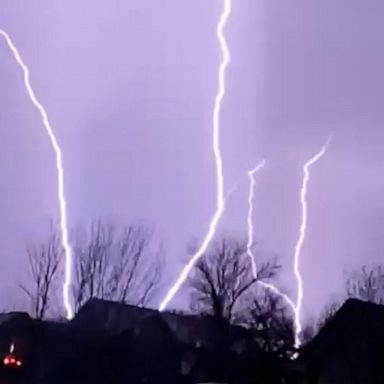 Slow-motion video captured lightning strikes spidering across the night sky in Wichita, Kansas, as severe thunderstorms moved through the area.