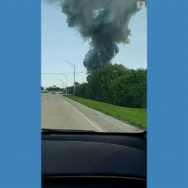 A column of thick smoke rose from a major fire at a scrap metal facility near Port Manatee, where crews have responded to extinguish the flames.