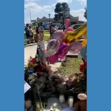 Flowers and crosses bearing the names of the 21 victims of the mass shooting at Robb Elementary School were placed at a memorial in Uvalde's town square. 