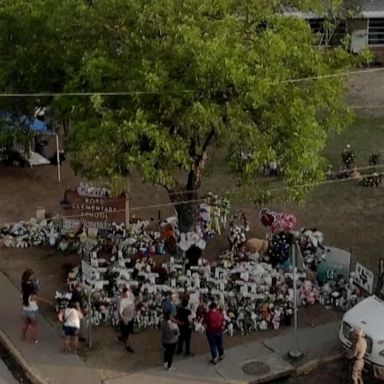 Uvalde residents visited a memorial in honor of the victims of the Robb Elementary School shooting, placing flowers, candles and pictures.