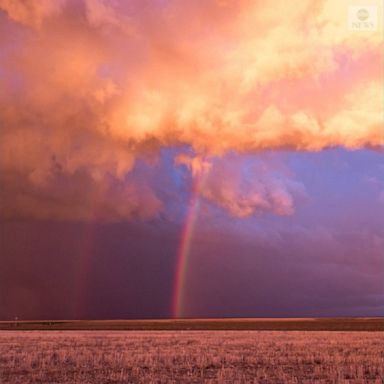 A sunset brought pink clouds, a double rainbow and lightning to the Colorado sky.