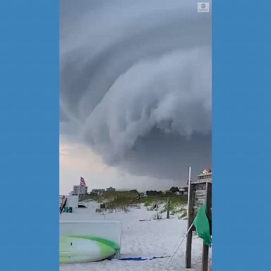 Beachgoers spotted a fast-moving storm cloud over Pensacola Beach in Florida as the National Weather Service warned of possible hail and high winds in the region. 