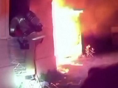 WATCH: Emergency workers rescue toddler from burning home