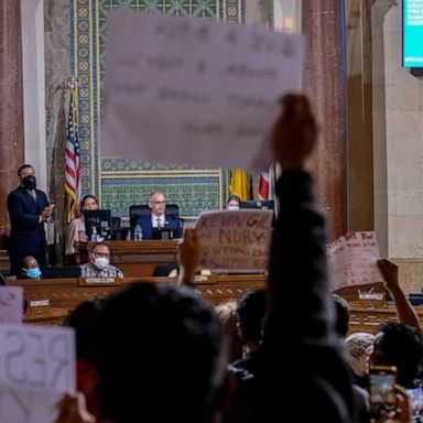 Protesters and other council members are demanding the resignation of two city council members after a recording emerged of a member making offensive comments.