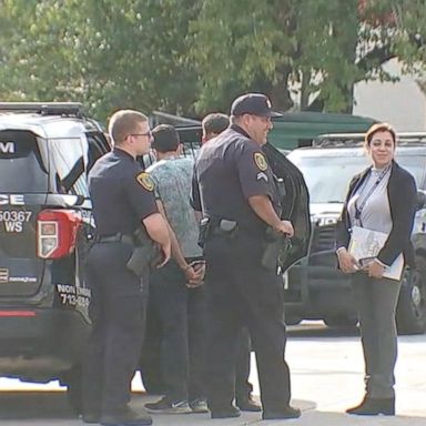 Nine men were detained after police stopped two vehicles leaving a Houston-area hotel on Wednesday.