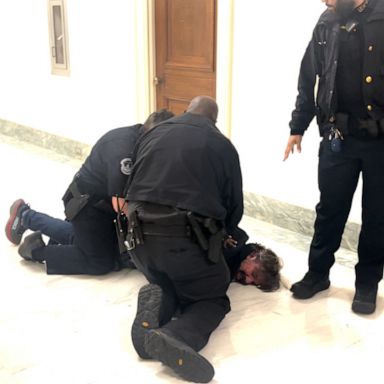 Manuel Oliver and his wife, Patricia Oliver, were removed from the House oversight subcommittee hearing by Capitol Police officers at the direction of Chairman Pat Fallon.