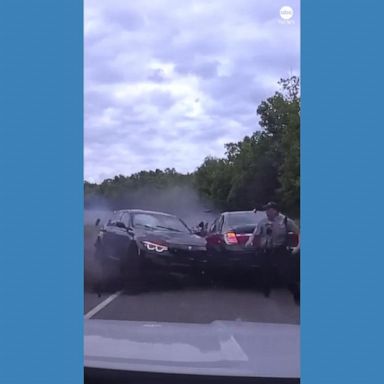 VIDEO: Officer nearly crushed by out-of-control car