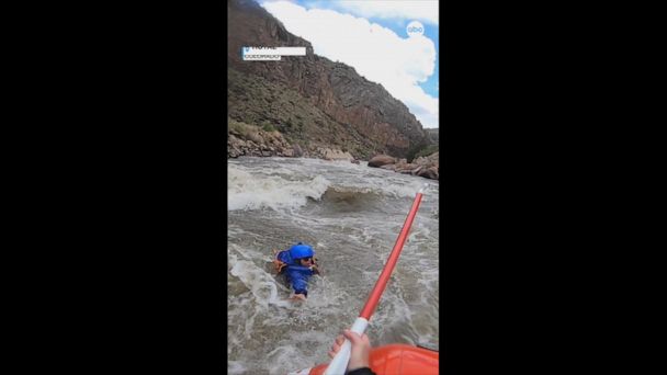 Video Woman rescued from raging rapids