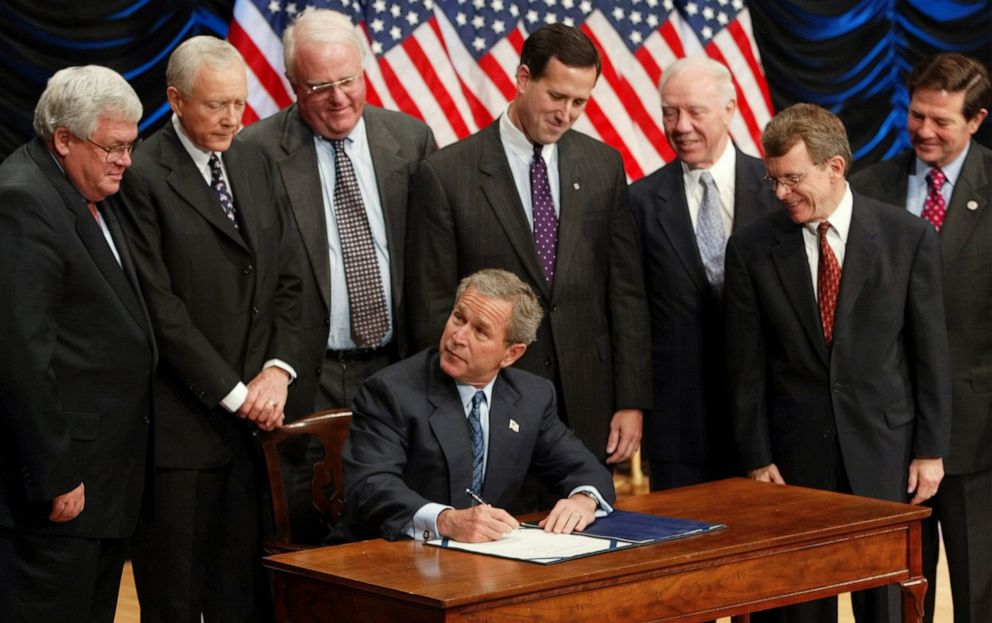 PHOTO: President George W. Bush is surrounded by members of Congress as he signs the Partial-Birth Abortion Ban Act, at the Ronald Reagan Building in Washington, D.C., on Nov. 5, 2003.