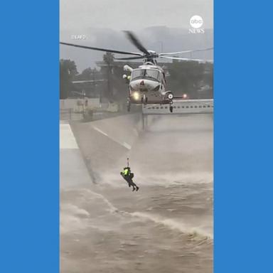 VIDEO: Firefighters rescue man who was trying to save dog from rushing water