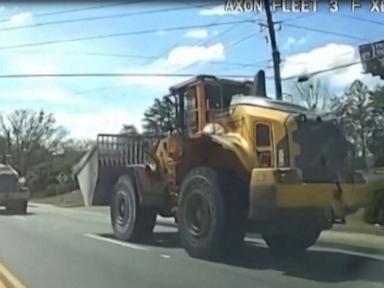 WATCH:  Police say an ex-employee led police on a slow-speed chase of a stolen front-loader