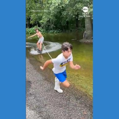 VIDEO: No boat required: Kids wakeboard down flooded street in Louisiana