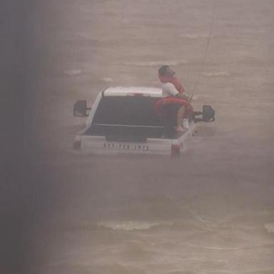 VIDEO: Firefighters work to rescue driver caught in flood