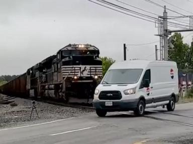 WATCH:  Van narrowly misses being hit by oncoming train at crossing