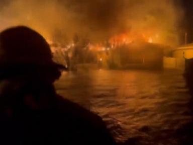 WATCH:  Crews navigate floodwaters and house fire to rescue people in wake of Hurricane Helene