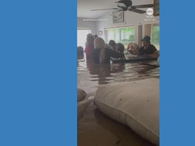 WATCH:  Group of people stand in chest-high water in flooded home from Hurricane Helene