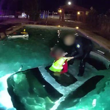 Police officer rescues driver from car in swimming pool