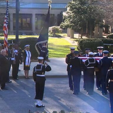 Motorcade arrives at the Jimmy Carter Presidential Library for state funeral