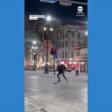 Skater plays hockey on icy Canal Street in New Orleans