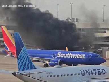 WATCH:  American Airlines flight catches fire at Denver airport