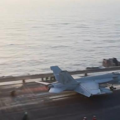 An F/A-18 fighter jet rolled off the side an aircraft carrier and sank to the bottom of the Red Sea, the Navy announced on Monday.