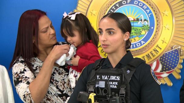 Florida police officers reunite with toddler they saved from near-drowning