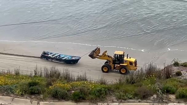 Boat washes ashore with 3 dead, 9 unaccounted for, 4 survivors