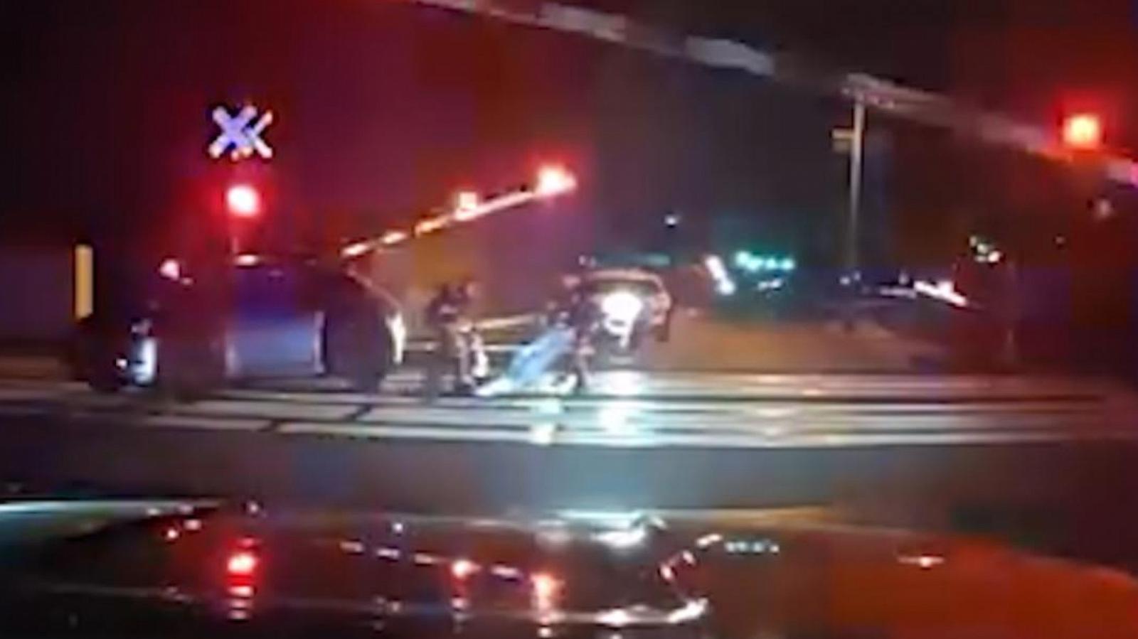 WATCH:  Impaired driver pulled from car seconds before train crash