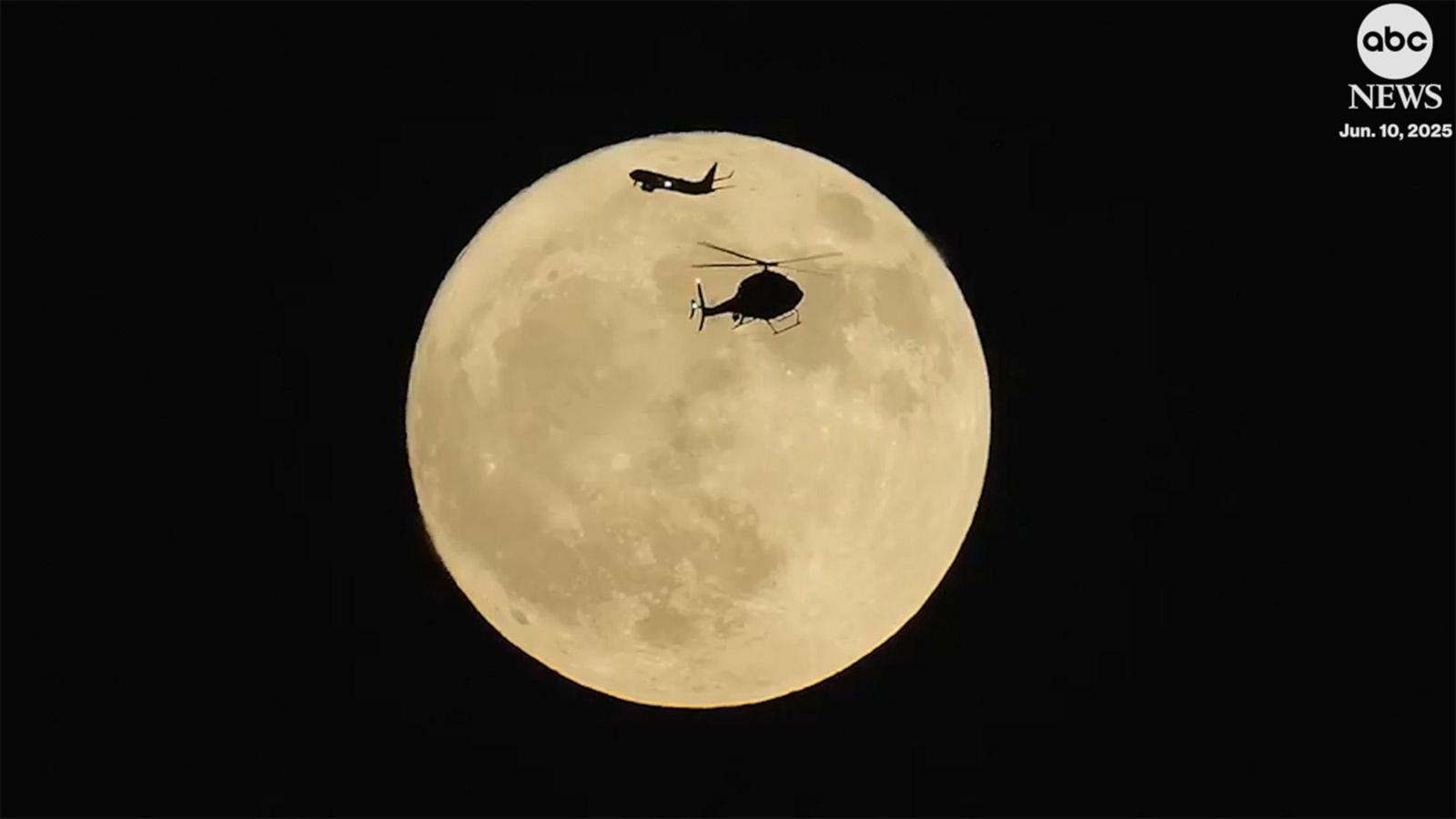 WATCH:  Stunning moment helicopter and plane pass in front of ‘strawberry moon’ over Chicago