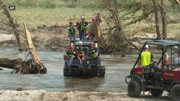 Some debris piles '50 feet high,' Texas volunteer rescuer says