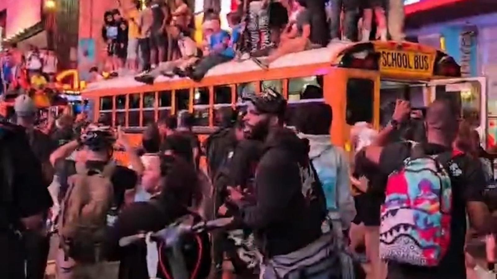 Nba Bus Fans scale buses in Times Square after Knicks win NBA title - Good ...