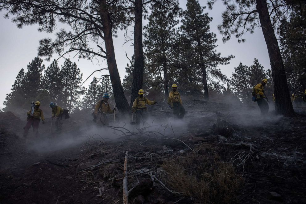 PHOTO: Inmates working as firefighters, kick up ash as they descend out of Fremont National Forest, while helping to mop up remaining hot spots from the Brattain Fire in Fremont National Forest near Paisley, Ore., Sept. 20, 2020.
