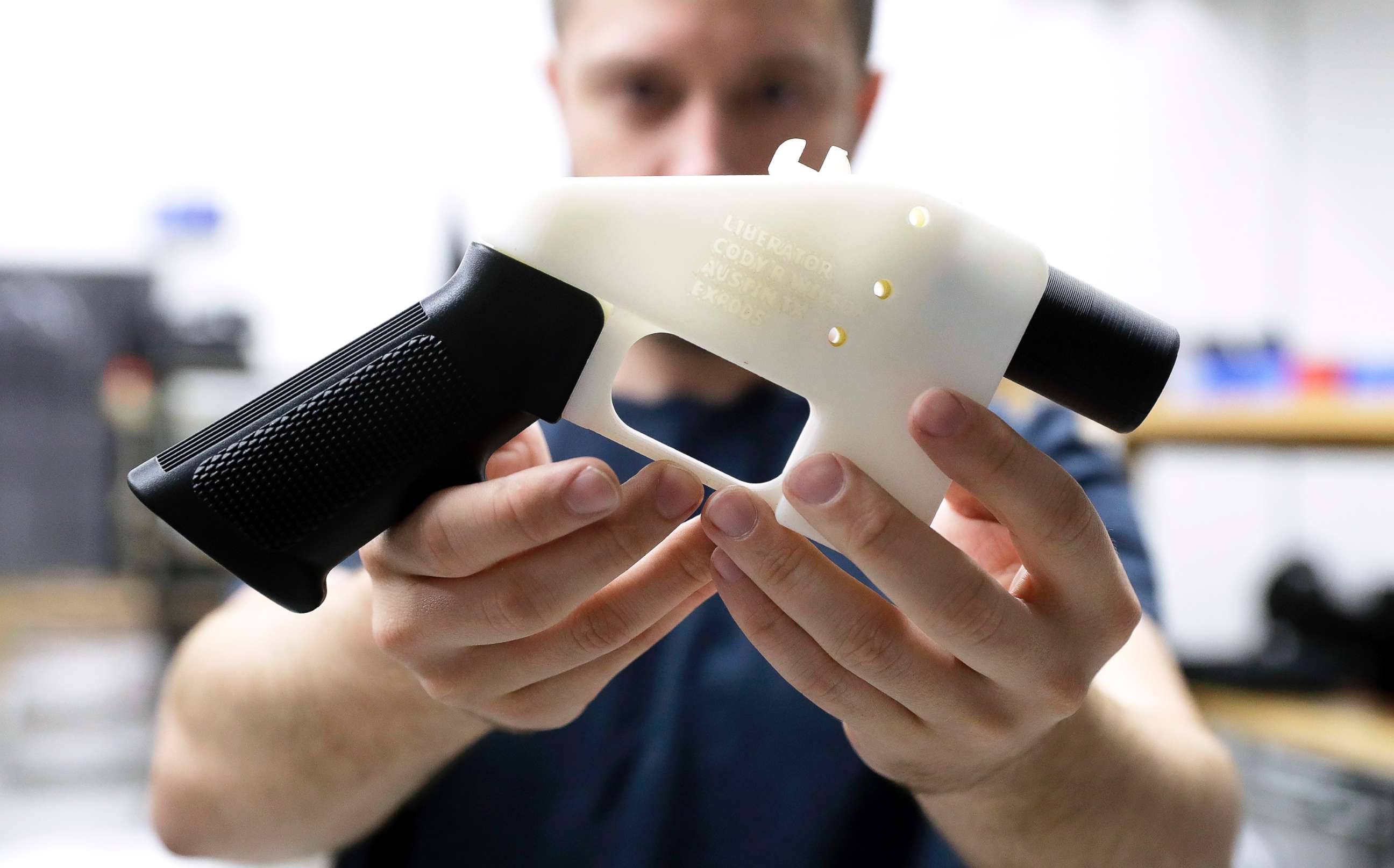PHOTO: Cody Wilson holds a 3D-printed gun called the Liberator at his shop on Aug. 1, 2018, in Austin, Texas.