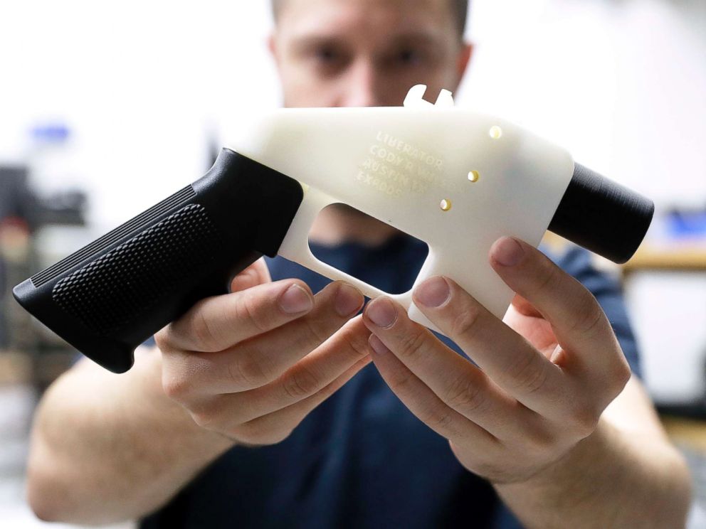 PHOTO: Cody Wilson holds a 3D-printed gun called the Liberator at his shop on Aug. 1, 2018, in Austin, Texas.