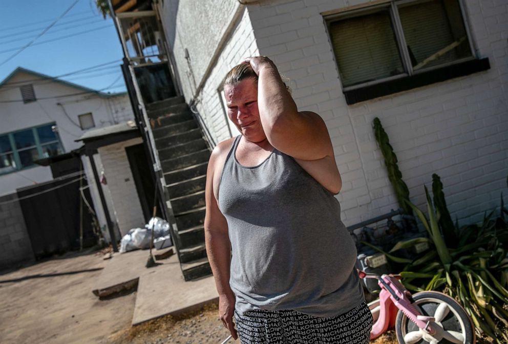 PHOTO: A woman is overcome with emotion after she was served a court eviction order for non-payment of rent on Sept. 30, 2020 in Phoenix.