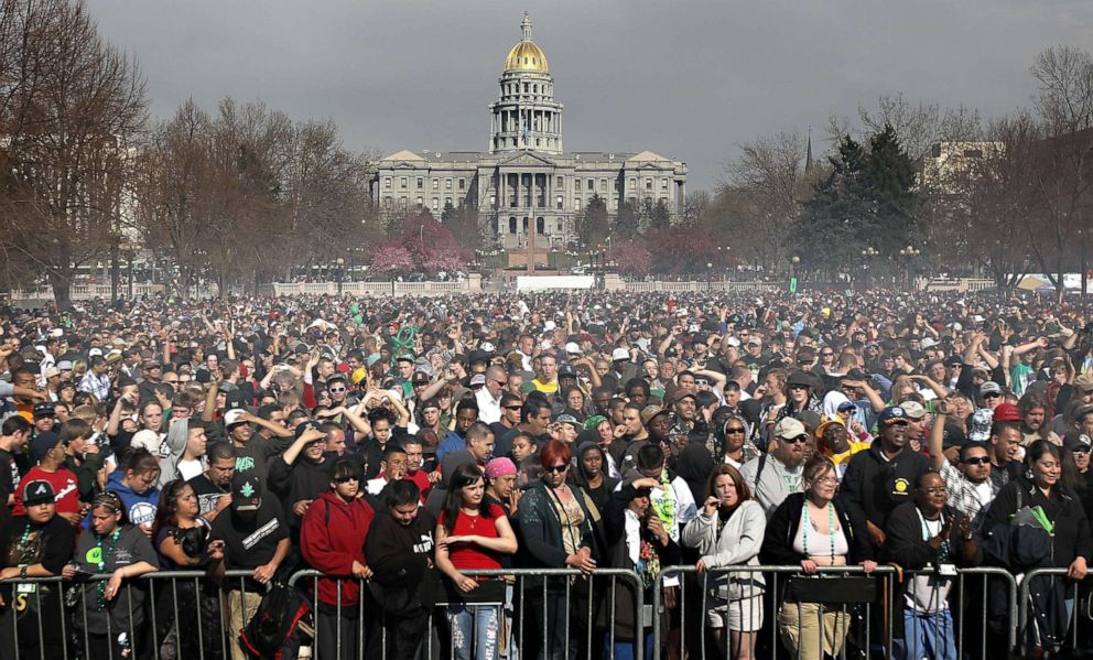 PHOTO: Marijuana smoke rises from a smoking crowd, April 20, 2010, at a pro-pot "4/20" celebration in front of the state capitol building in Denver.