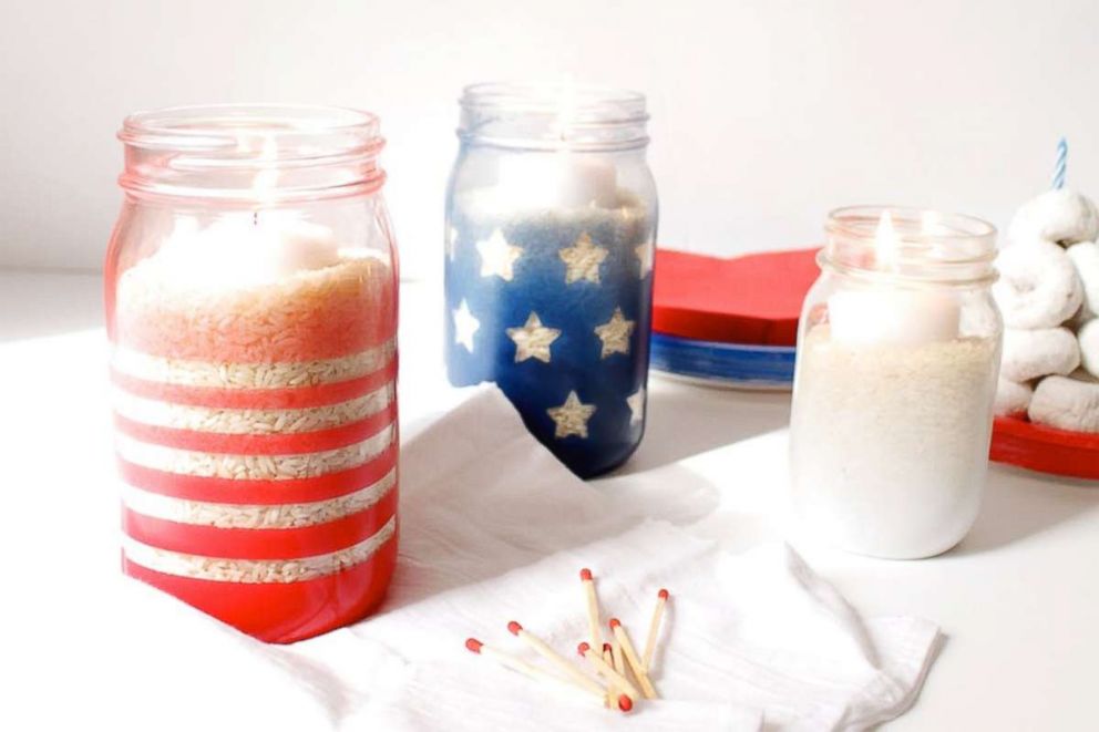 PHOTO: Brit + Co shows how to make patriotic DIY candle holders out of mason jars.