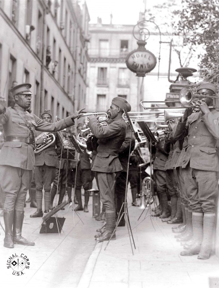PHOTO: African American musicians members of the 369th Infantry Regiment band led by Lt. James Reese Europe, play jazz in the courtyard of a hospital for wounded Americans, in Paris, 1918.