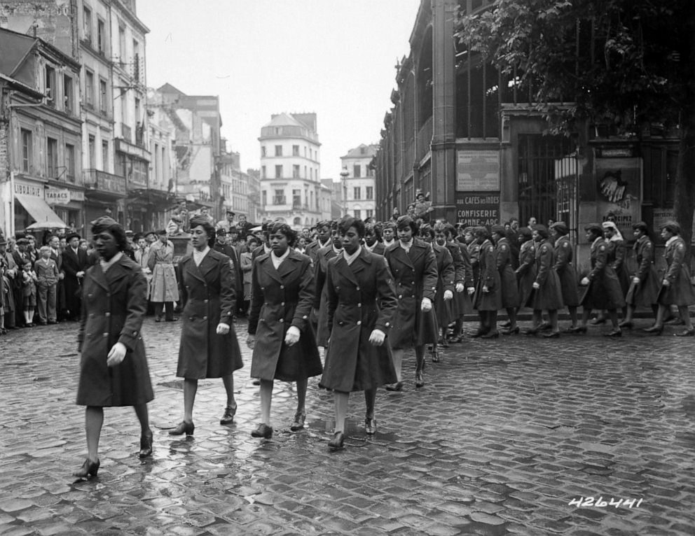 PHOTO: Members of the 6888th Central Postal Directory Battalion take part in a parade ceremony in honor of Joan d'Arc at the marketplace where she was burned at the stake, 1945.