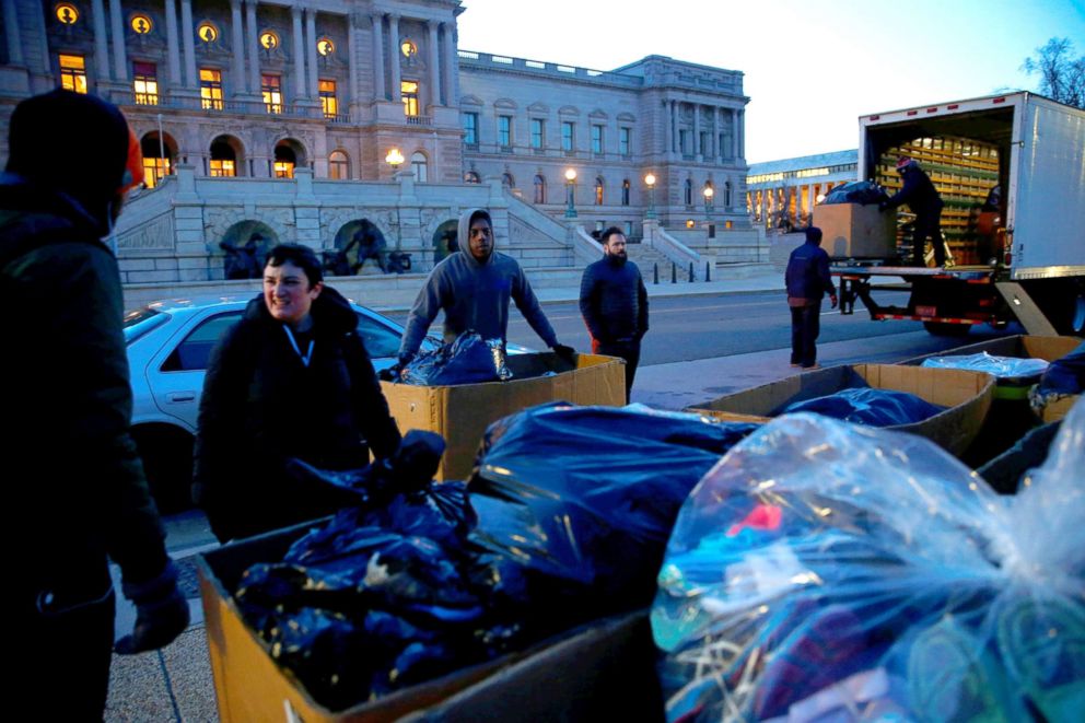PHOTO: Activists with AVAAZ unloading 7000 shoes in the early morning hours on Capitol Hill in Washington, DC, March 13, 2018. The shoes were laid out on the lawn at the Capitol as a symbol to the number of lives lost to gun violence since Newtown, CT.