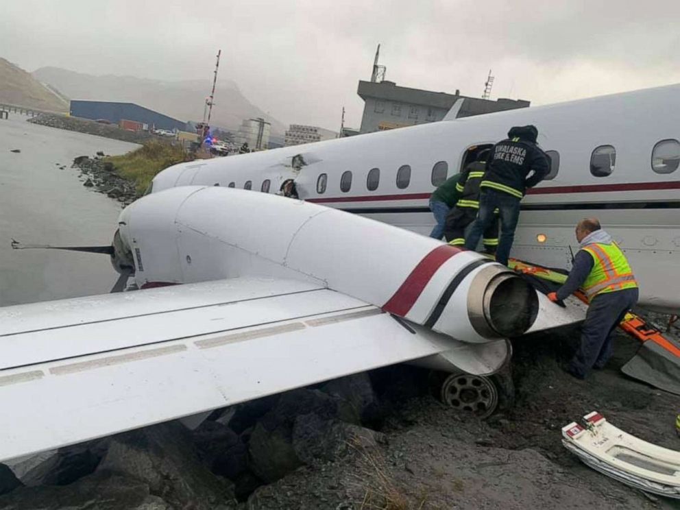 PHOTO: Alaska Airlines Flight 3296, operated by Peninsula Airways, sits at the edge of Unalaska Bay after running off the runway while landing at Unalaska/Dutch Harbor Airport, Oct. 17, 2019.  