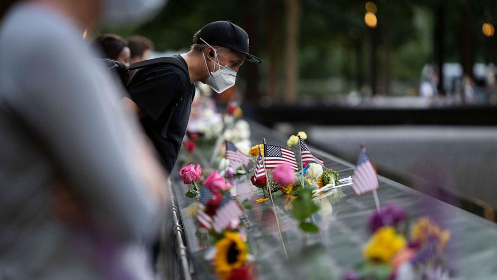 PHOTO: People commemorate victims in the 9/11 attacks at the National September 11 Memorial and Museum in New York, Sept. 11, 2020.