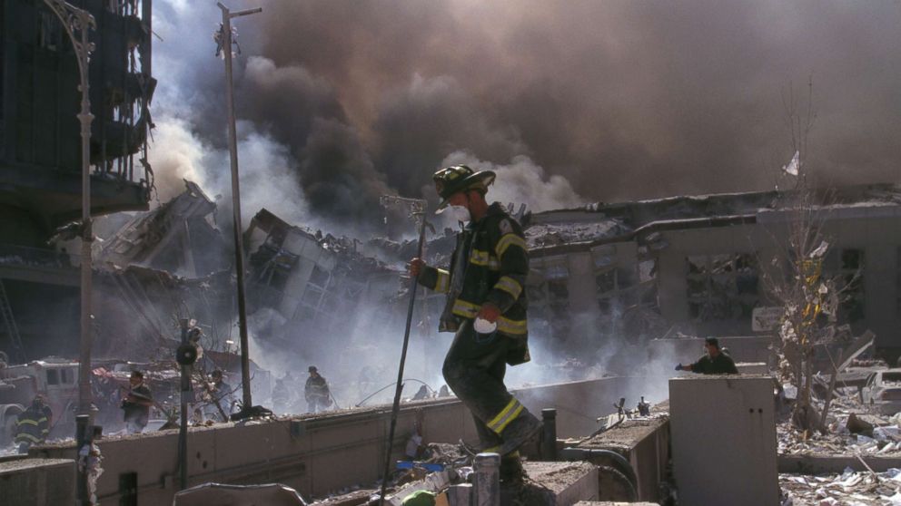 A New York City Firefighter makes his way amid the rubble of the World Trade Center following the attacks on the Twin Towers, Sept. 11, 2001. 