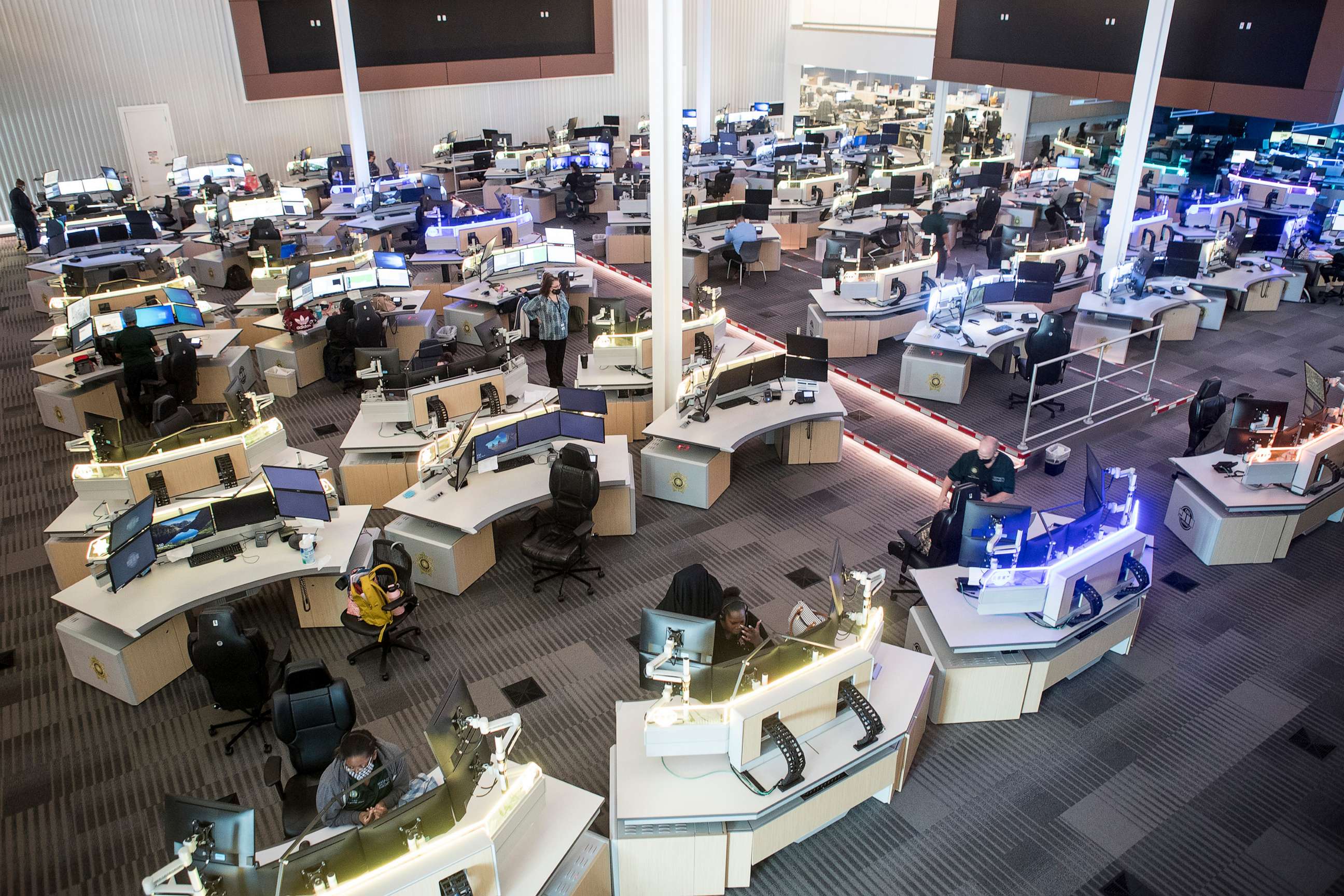 PHOTO: Communications officers work in the Harris County 911 Call Center, May 18, 2021, in Houston.