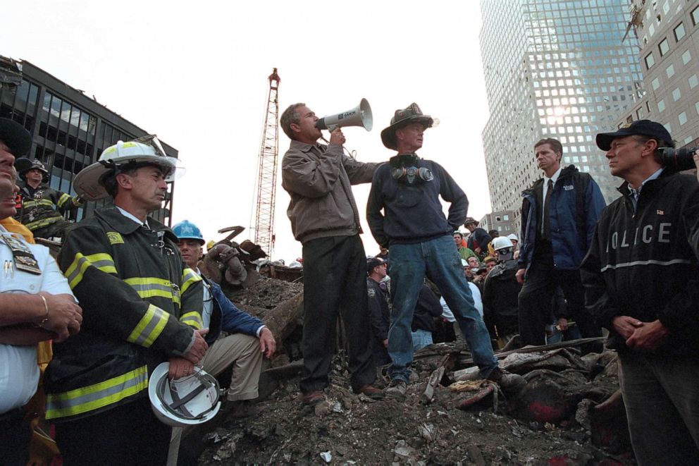 PHOTO: Standing atop rubble with retired New York City firefighter Bob Beckwith, President George W Bush rallies firefighters and rescue workers during an impromptu speech at the site of the collapsed World Trade Center in New York City, Sept. 14, 2001. 