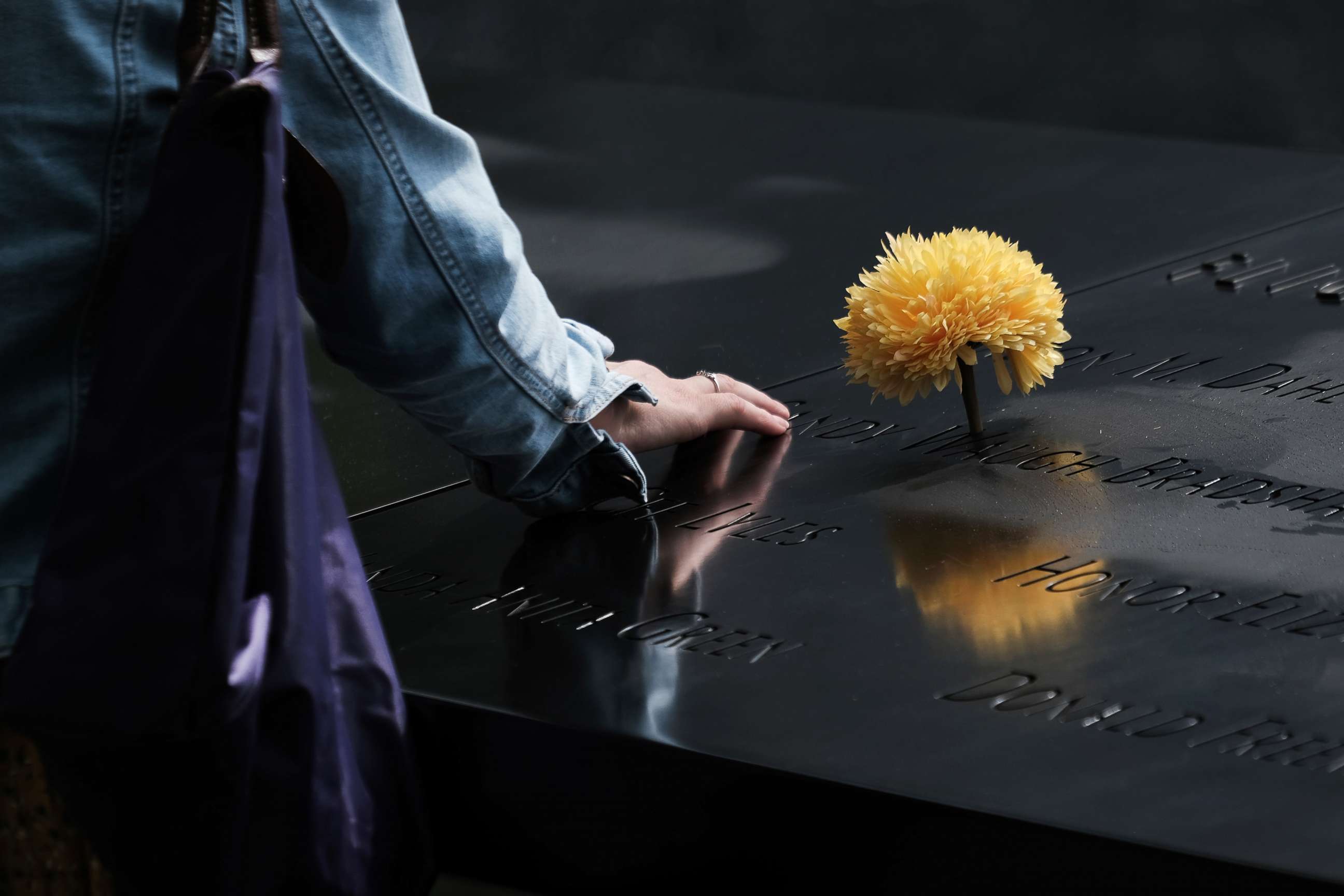 PHOTO: A woman mourns a relative at the September 11 Memorial at Ground Zero, Aug. 31, 2021, in New York City.